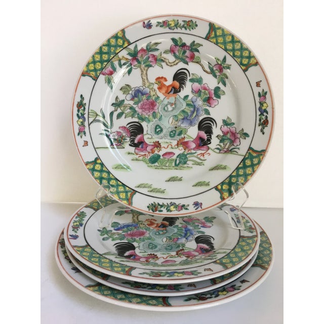 Offering a lovely set of 4 (two different sizes) Chinoiserie decorative plates in a Rooster motif with flowers and fruit...