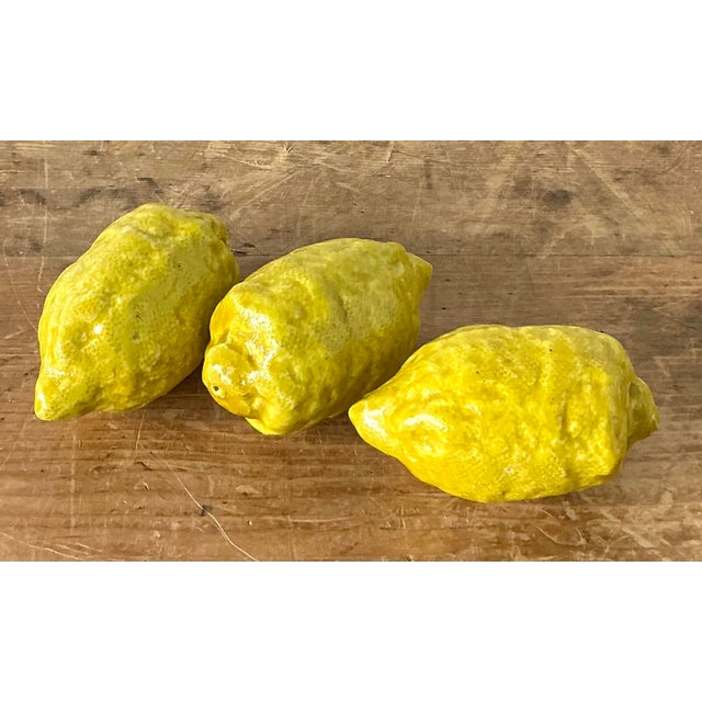 This delightful set of three vintage Italian majolica lemons is a quintessential example of traditional Mediterranean...