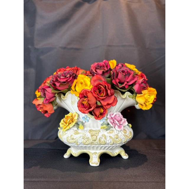 A true masterpiece of Italian craftsmanship, this vintage large Capodimonte porcelain flower vase is a stunning display of...