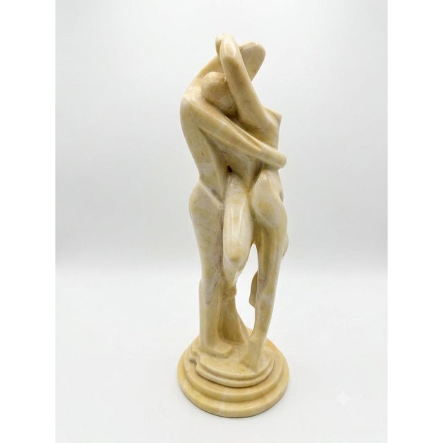 Capture the essence of romance and mid-century elegance with this striking vintage abstract sculpture depicting two lovers...