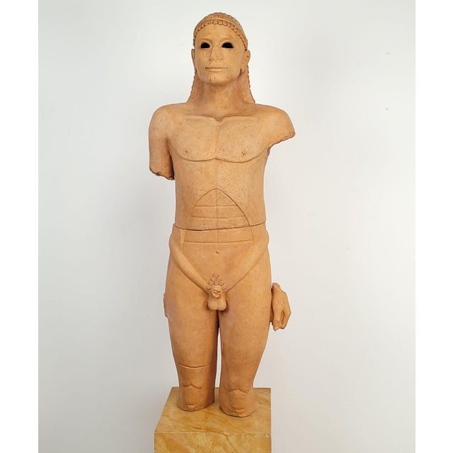 A 1970s pottery statue of a koros by Barry Kranz on later stand, California circa 1975.