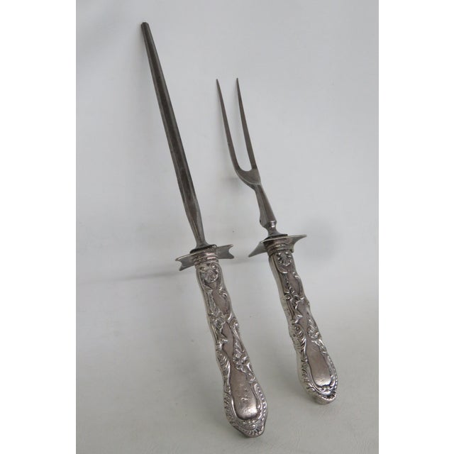 This gorgeous Roast Serving Utensil Pair is silver plated. This stunning carving set includes a sharpening steel and two-...