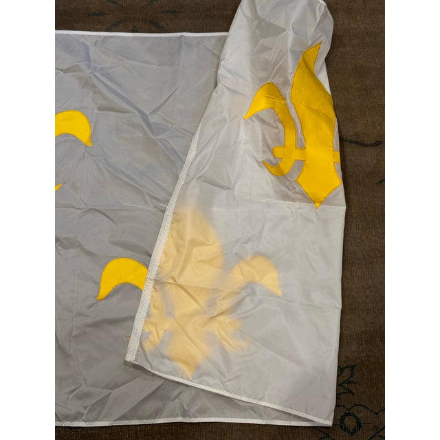 This is a late 20th century vintage French Fleur-de-Lis flag. It features three gold embroidered lilies on a white...