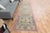 Vintage Hand-Knotted runner rug is a semi-antique vintage area rug. The '70s Eastern region of Anatolia's unique rug is...