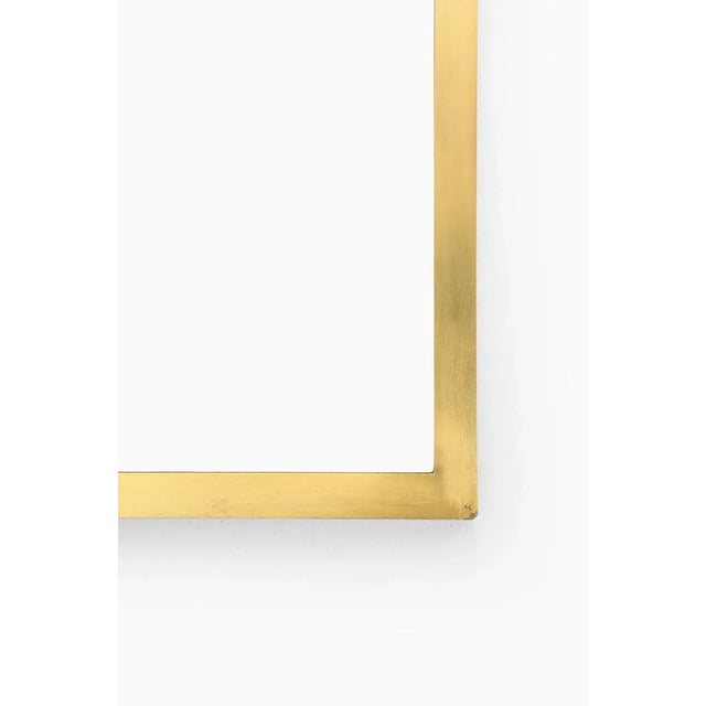 Modernist mirror in brass attributed to Josef Frank. Produced in Sweden.