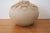 A striking piece of American studio craft — signed and dated 2007 by ceramic artist Hilda Kidd Wiesenmeyer. The bulbous,...