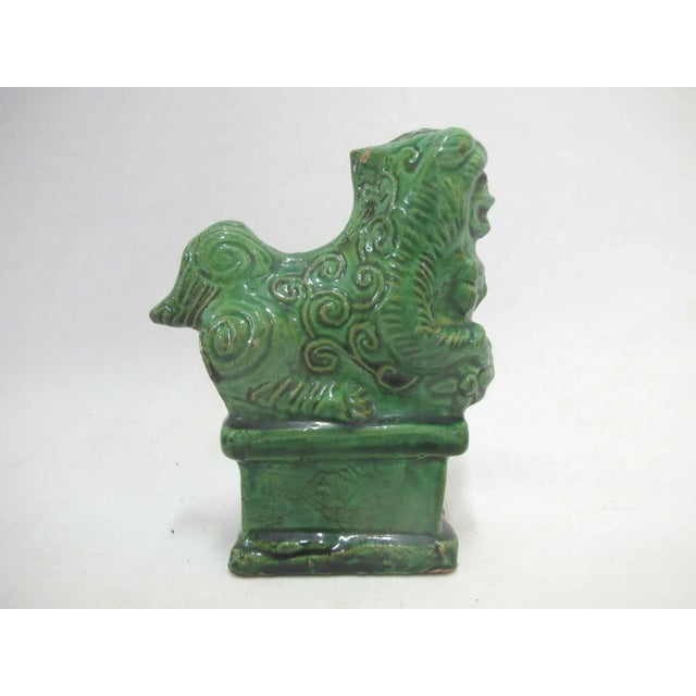 Chinese vintage figurine or incense holder. Green tone, figural foo dog shape. Measures 5 1/2" tall x 4 1/4" x 1 5/8"....