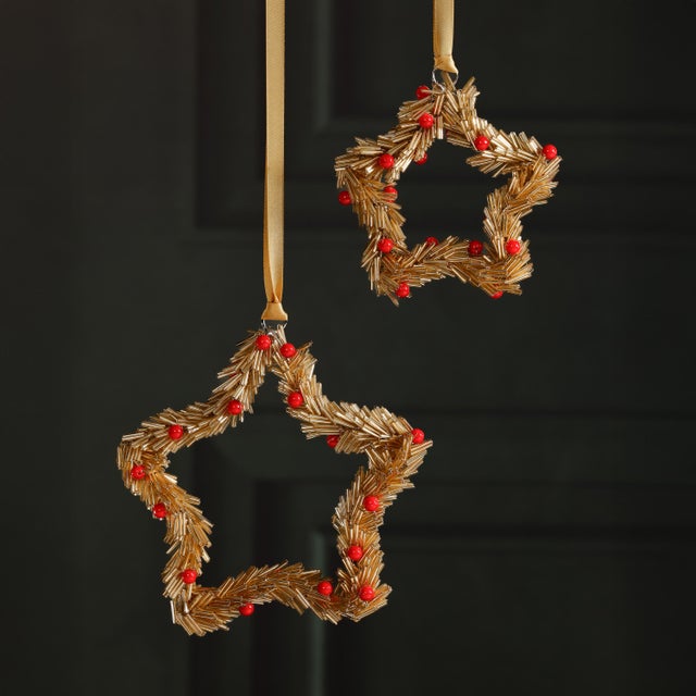 Celebrate the season with these festive beaded ornaments, thoughtfully crafted from iron and glass in either star or round...