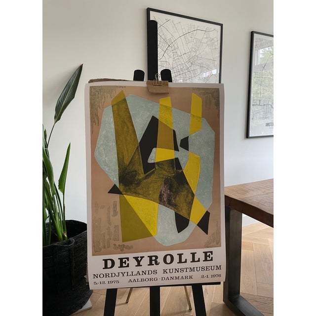 This exhibition poster, printed in Denmark, represents the work of renowned French abstract artist Jean Deyrolle. Known...