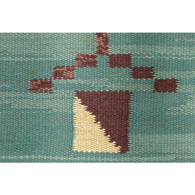 Mid-20th century Swedish green handmade wool rug Size: 10'6" × 15'9" (320 × 480 cm). A rare and striking example of mid-...