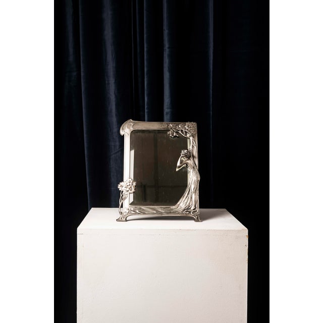 Elegant art nouveau dressing table mirror made by the german firm wmf. the sculptural frame is crafted from silver-plated...