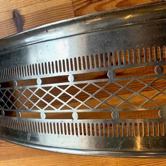 High quality 19th century antique English cast iron/polished steel fire fender. We love the pierced design which would...