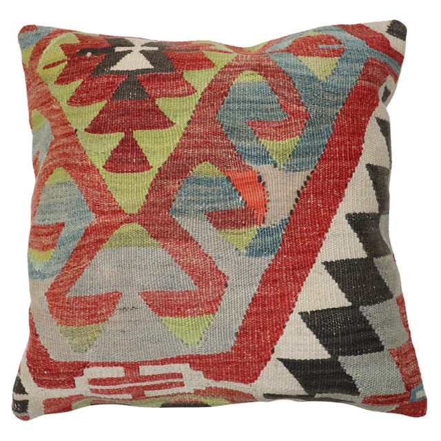 Pillow made from an antique Turkish Kilim flat-weave. Measures: 19” x 20”.