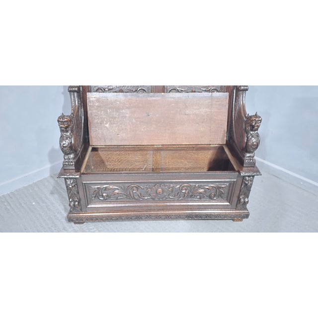 A lovely quality European oak hall bench, settle or monks bench, with super carving, lift up lid, good carved lion arm...