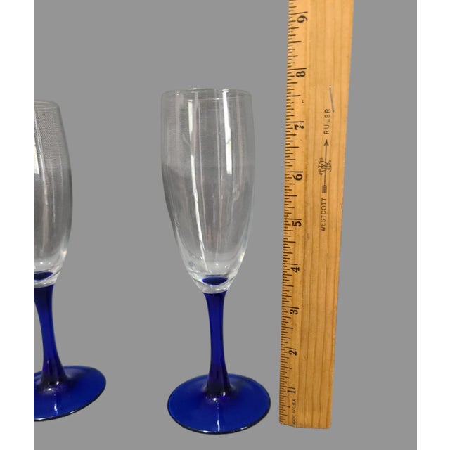 Elevate your champagne experience with these stunning vintage Luminarc French cobalt blue stem flute glasses. Crafted from...