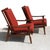 Vintage midcentury pair of Danish lounge chairs Walnut frame. Recently reupholstered in a warm red textile.