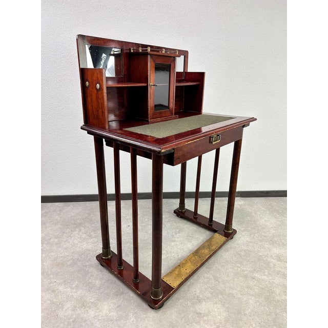 Smaller secession writing table with brass fittings in original vintage condition with signs of use.
