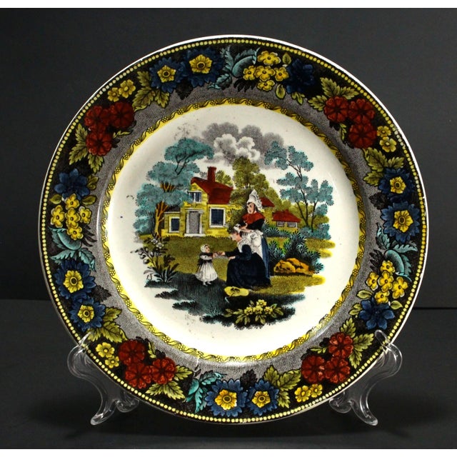 An amazing early French faience plate Intricate and very detailed hand tinted black transfer scene at the center,...