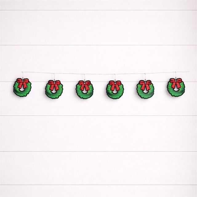 Brighten your home with festive sparkle using this LED Wreath Garland Light Set with Red Bow. Featuring a strand of...