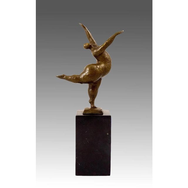 Bring movement, elegance, and contemporary artistry into your space with this bronze statue, the “Balancing Nude Dancer,”....