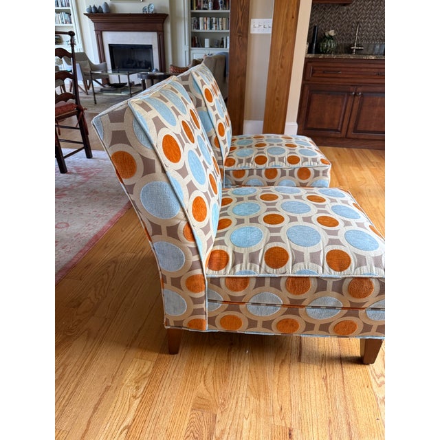 This sophisticated and exceptionally comfortable set of 2 armless chairs provides extra seating options with clean,...
