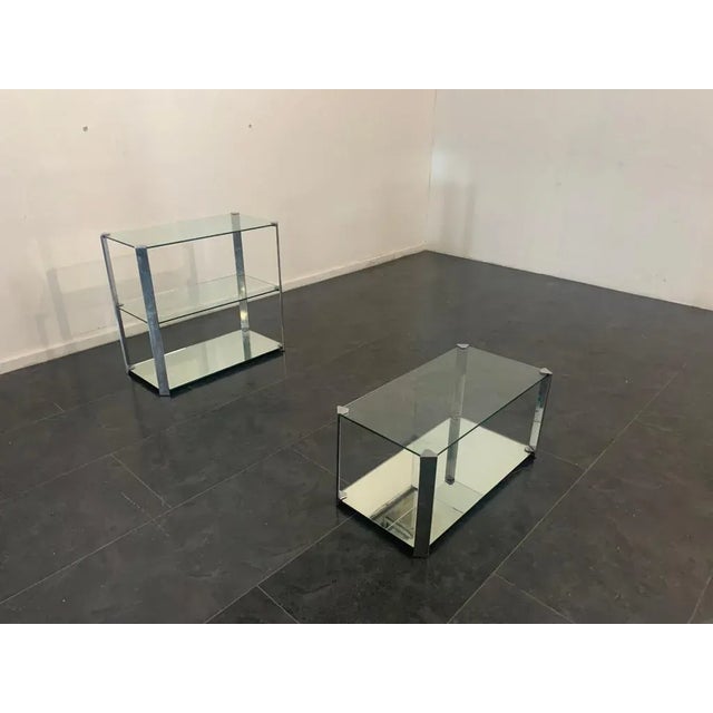Living room set consisting of: Coffee table with crystal top, the mirrored base, the steel uprights carry manufacturer's...