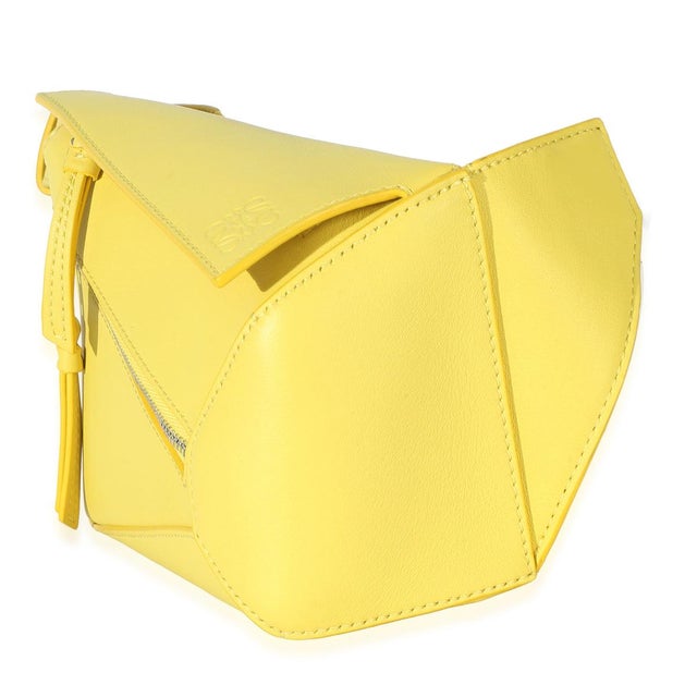 Item #: 153231 Interior Material: Fabric Size: Mini Handbag Closure Type: Zip-Top Dimensions: 6.5 x 4 x 2.75 in Circa:...