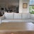 Custom high end sofa commissioned by decorator . Blue gray . Original cost $6566. Manufacturer not know since arranged...