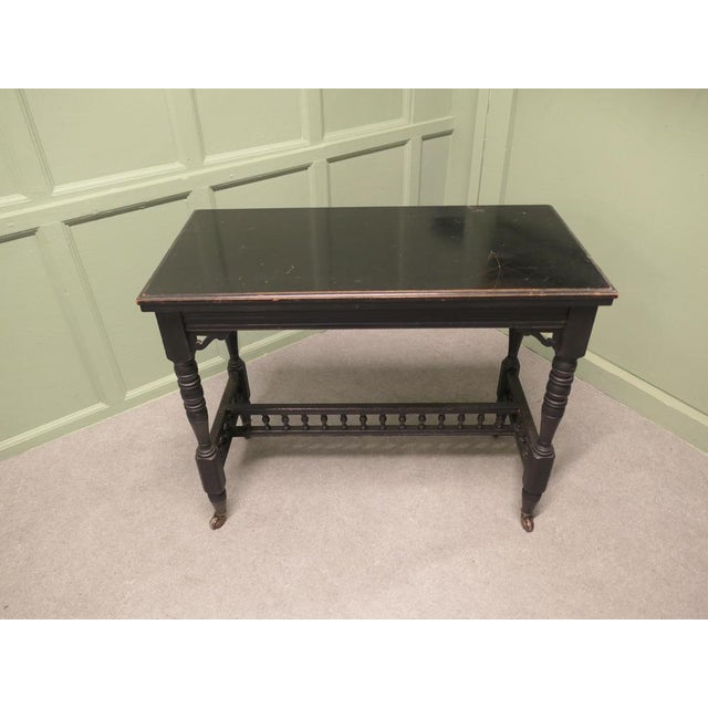 Elegant Black Lacquer Games, Card or Hall Table This stylish Victorian piece has an ebonised finish which is a smooth...