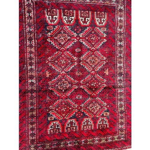 Pretty mid century Turkmen Baluch rug with a stylized designs and nice colours with red, purple, orange, brown, white and...