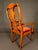 An exceptional pair of late 19th-century English Queen Anne-style armchairs, beautifully crafted and richly detailed,...