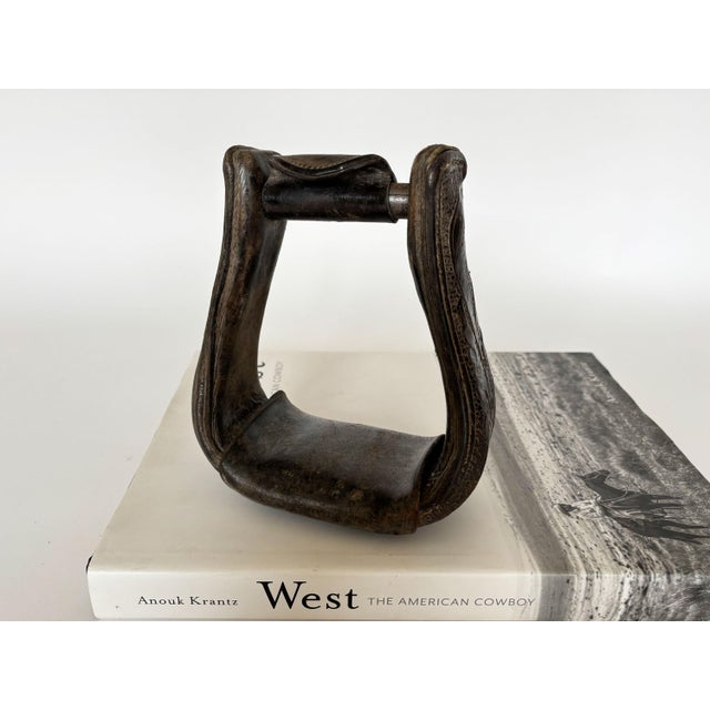 Add texture and character to your southwest décor with this single vintage leather western horse saddle stirrup. The...