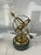 beautiful brass sculpture on a green marble base. A perfect desktop accessory or decorative item for a study or office.