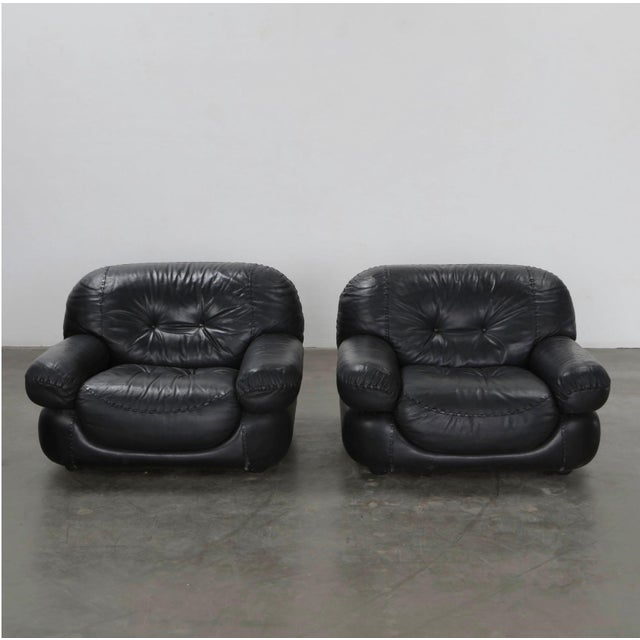 A stunning and exceptionally comfortable Italian Black Leather lounge chair attributed to Adriano Piazzesi. These chairs...