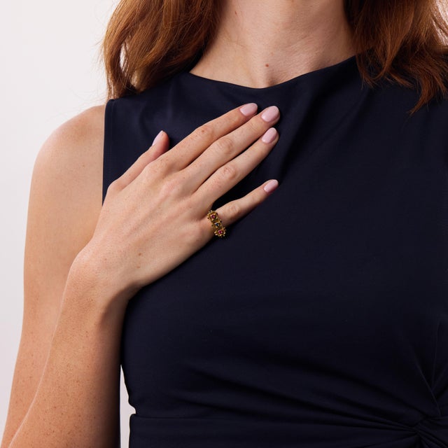 This striking vintage ruby and sapphire ring is a bold 1970’s design, full of texture, color, and sculptural presence....