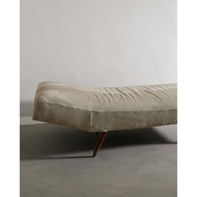 Rare swedish sculptural mid century daybed with dark stained teak wooden legs and later beige hide upholstery produced in...