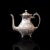 This is an antique tea service. An English, silver plated, hand chased teapot and jug set by John Turton of Sheffield,...