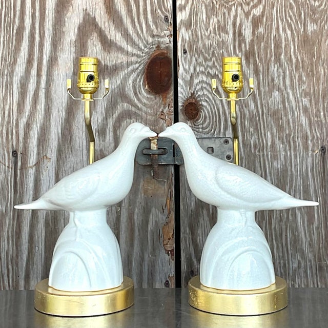 A stunning pair of vintage Boho table lamps. Beautiful Ivory glazed ceramic love birds thst rest on a gilt plinth. Fully...