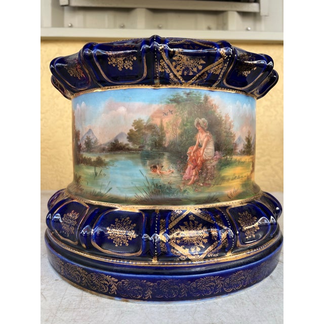 Antique Round plinths, decorated with gilt foliate scrollwork as well as bordering. Painted within figurative scenes....