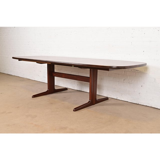 A sleek and stylish mid-century Danish Modern sculpted rosewood extension dining table By Skovby Møbelfabrik Denmark,...