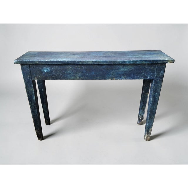 Wooden console table crafted from an old farmhouse table. The patina was applied using pigments in the Florentine patina...