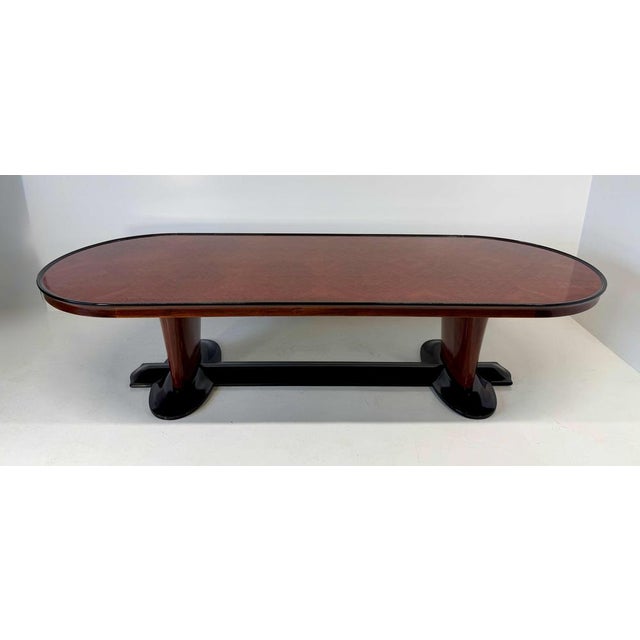 Elegant and unique Italian Art Deco table from the late 1940s, crafted from fine hardwood and featuring a richly figured...