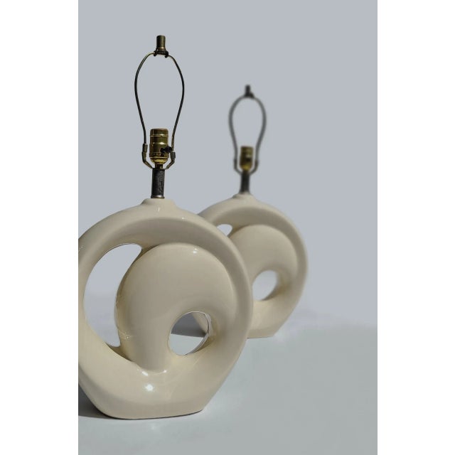 Depending on the natural light, this pair of ceramic swirl lamps will look ever-so pale yellow or a velvety froth of...