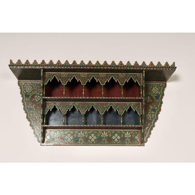 Wall shelf/bracket featuring carved and hand painted details (ca. 1940s/1950s, Morocco). Attractive geometric and floral...
