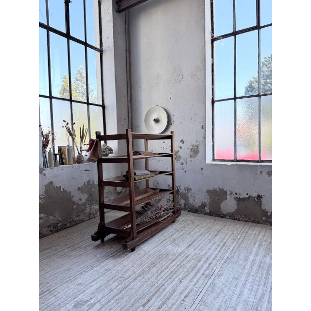 Vintage 1950s bakery shelf on casters. we love the mix of wood types—walnut, beech, pine—and the overall patina. A truly...