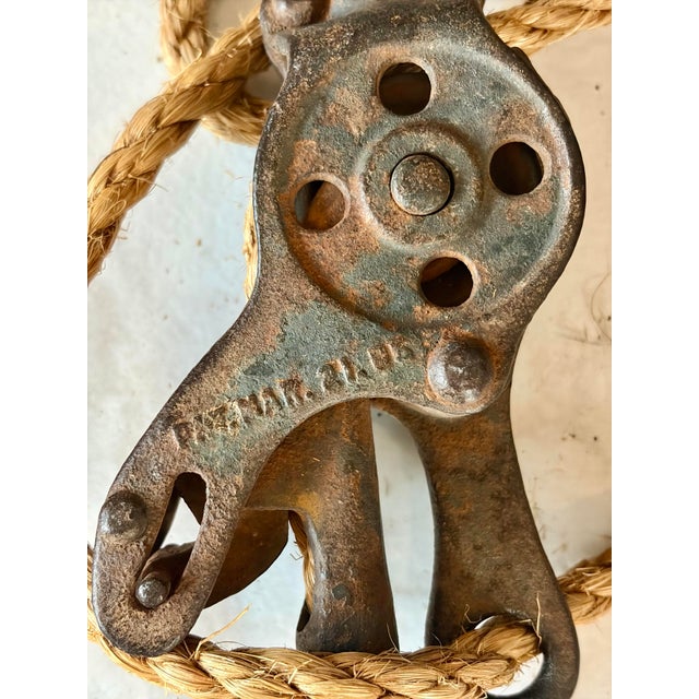 Complete with original heavy metal pulley hardware, large hook, chain, and natural-fiber manila rope. The pulley blocks...