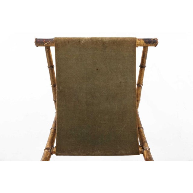 A beautifully atmospheric example of mid‑19th‑century French craftsmanship, this faux‑bamboo folding chair captures the...