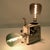 This Phonomatic P8 projector, a true vintage piece, has been transformed into a unique and captivating lamp. This object...