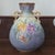 Beautiful 1885 Royal Bonn vase in blue with colorful orchids and gold accents.