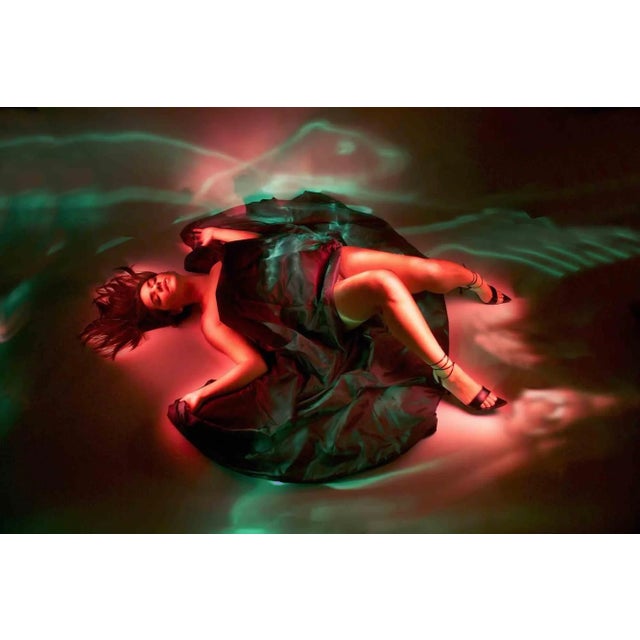 Light painting technique, realized in a completely dark photographic studio, where the photographer manually "paint" by...